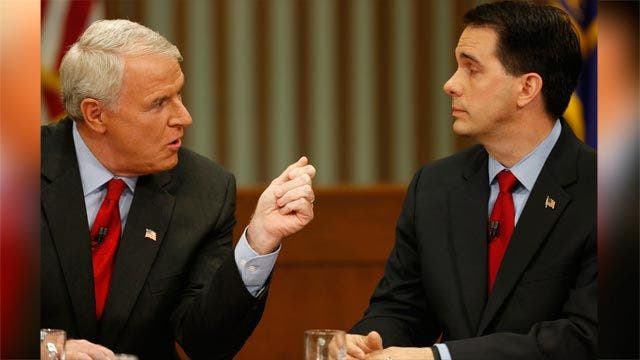Wisconsin voters head to polls in recall to decide whether to keep ...