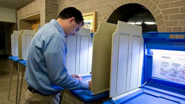 Wisconsin voters head to polls in recall to decide whether to keep ...